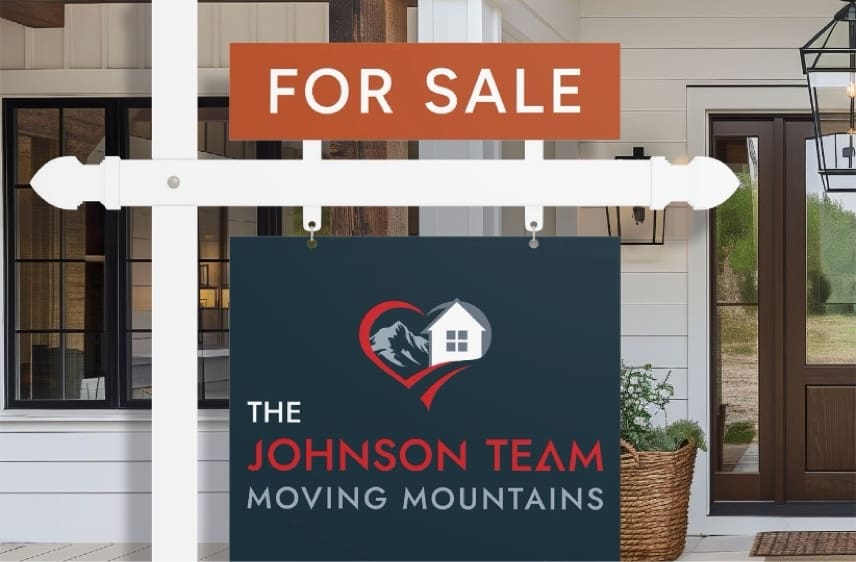 The Johnson Team For Sale sign in front of a home