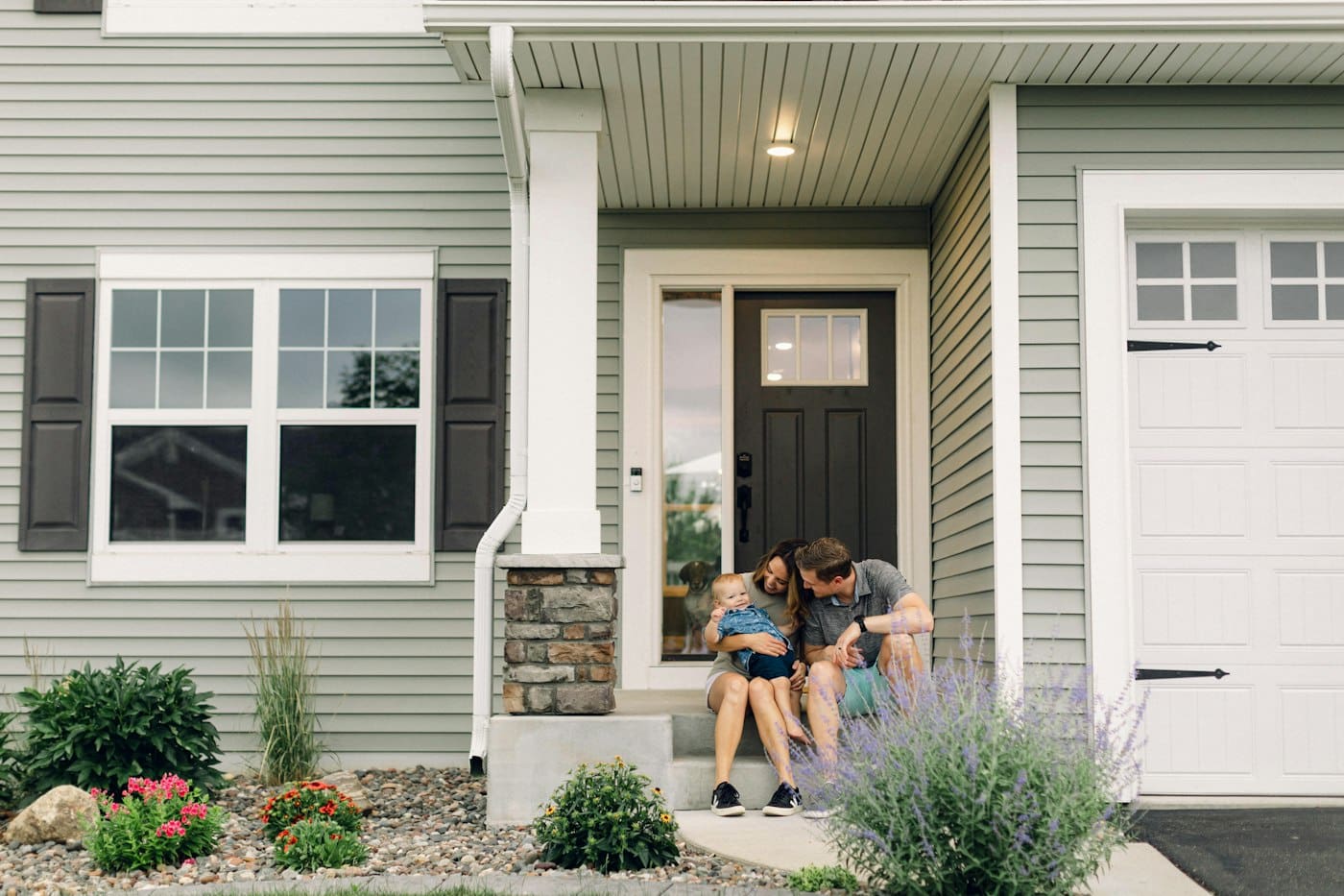 Sitting in front of a house