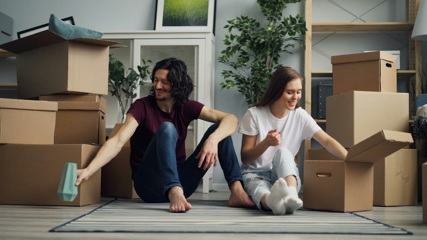 Couple on floor with boxes